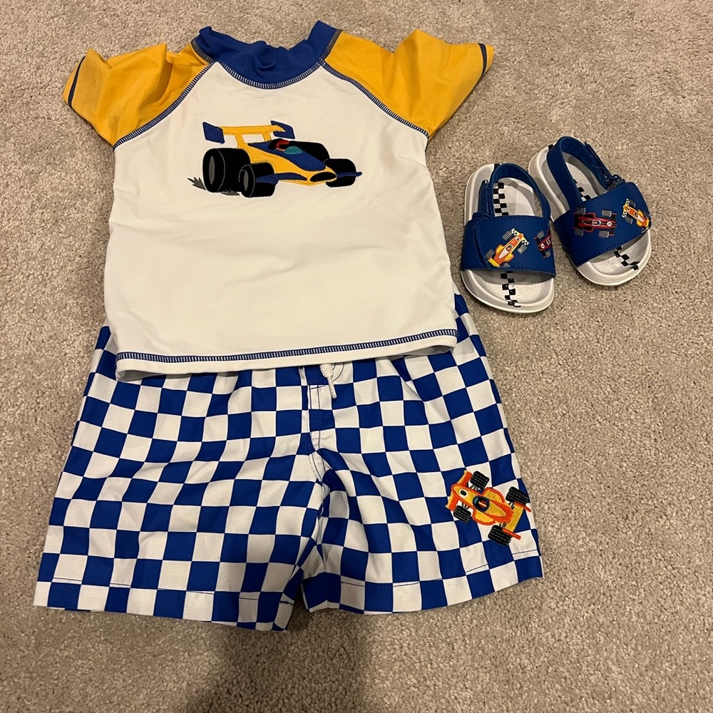 Like new Gymboree embroidered race car rashguard, swim shorts and slides set